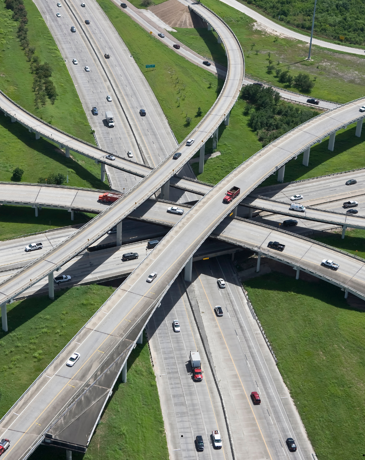 Complex motorway interchange, symbolising interconnected networks and pathways.