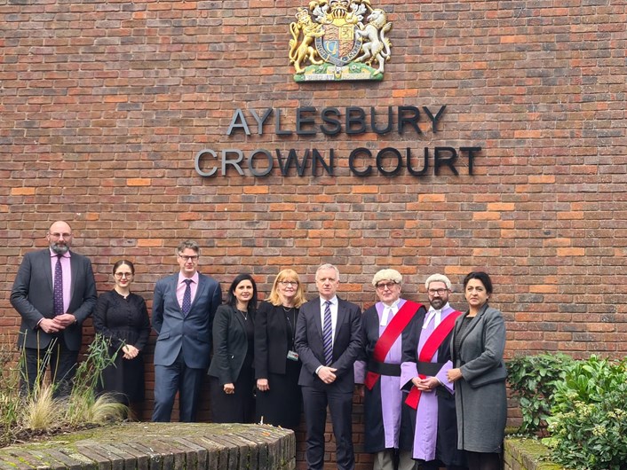 Group photo of Jaswant at Aylesbury Crown Court, with the Resident Judge, local MP, HMCTS and CPS staff