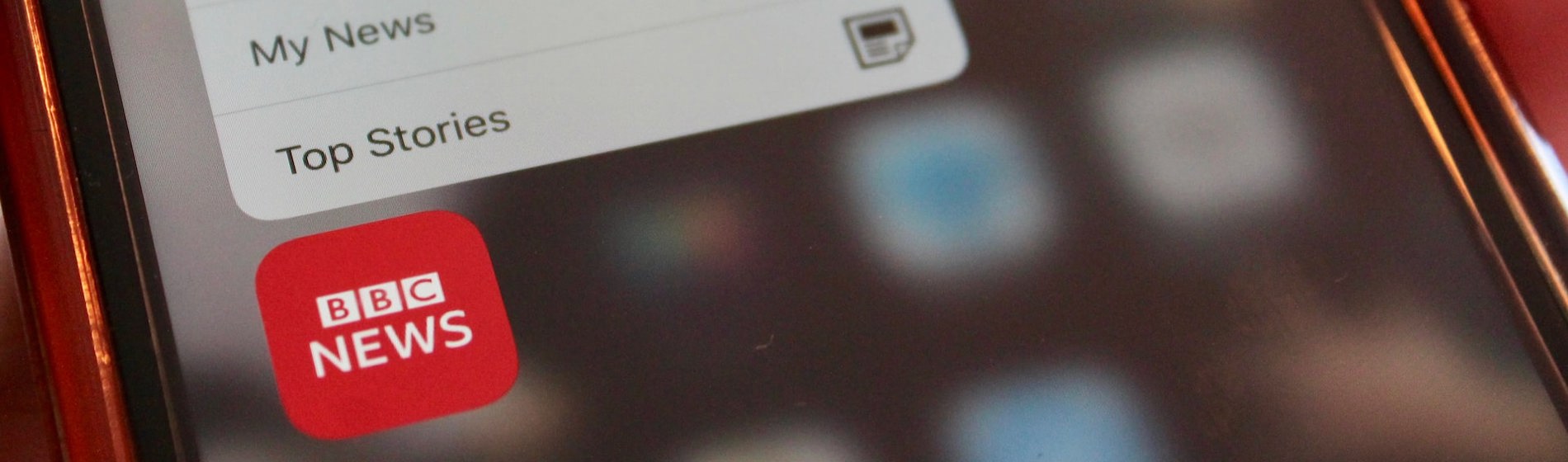 Close-up of the BBC News app icon and quick actions menu on a mobile phone screen.